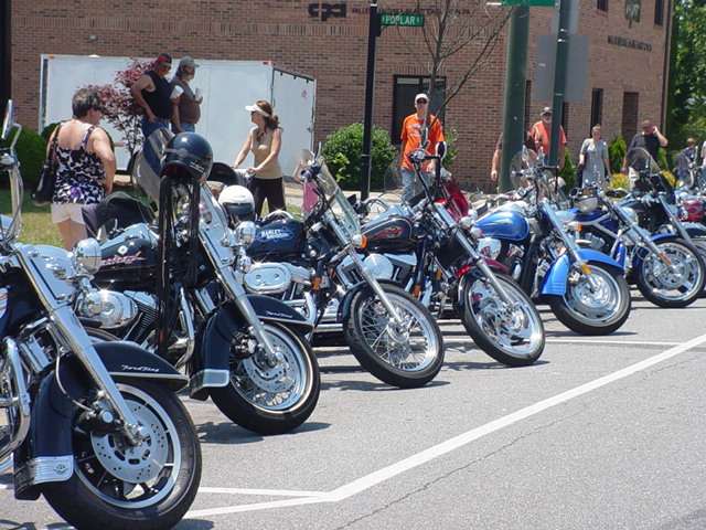 Motor bikes line the street